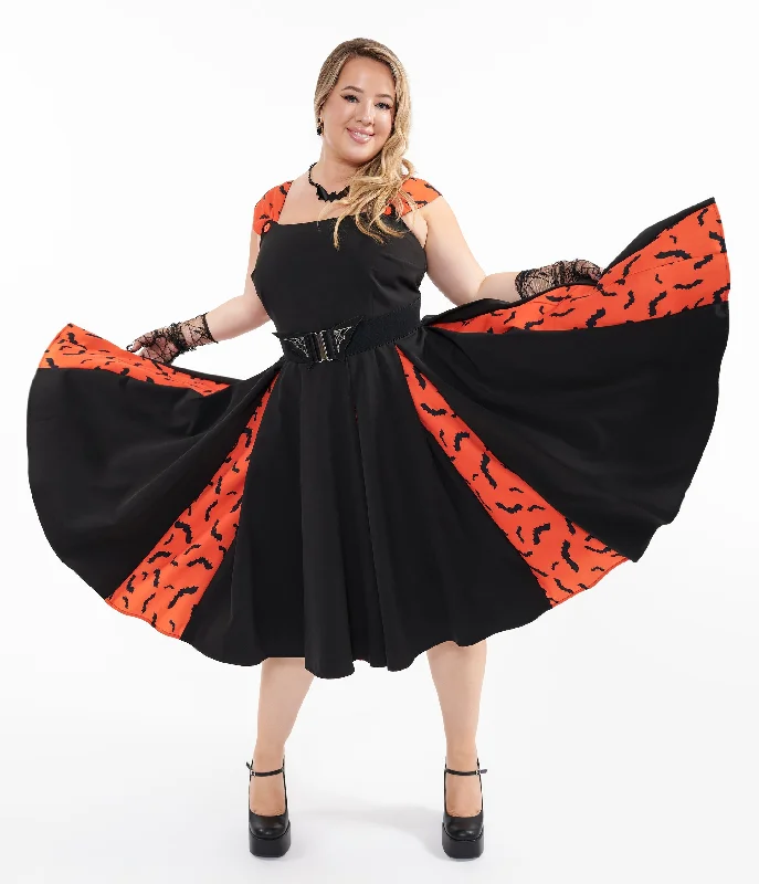 Plus size tropical - themed sundress for a sunny dayUnique Vintage Plus Size 1950s Orange & Black Bat Stripe Swing Dress